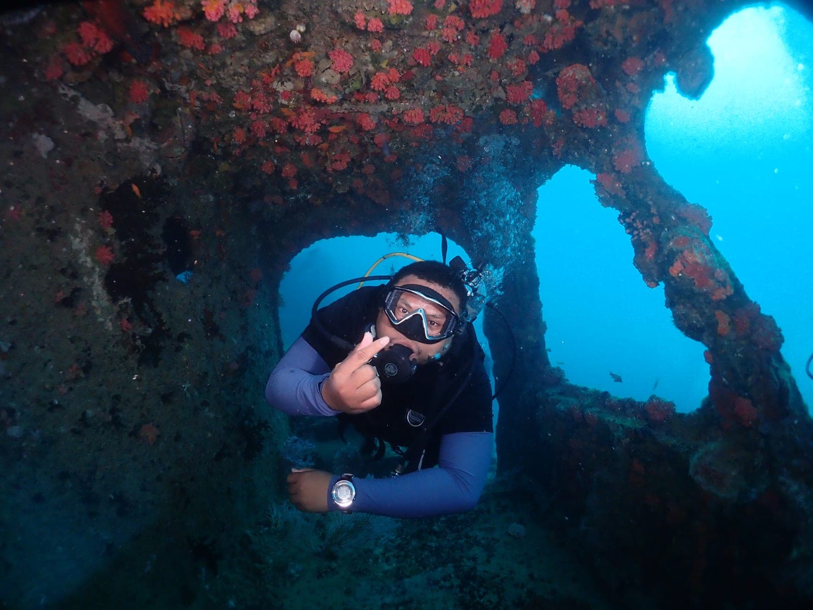 Arieffahmi scuba diving inside an underwater wreck